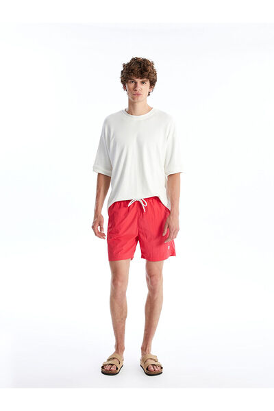 LC Waikiki NEVAVM Farkıyla شورت سباحة قصير للرجال من سلسلة Short Boy Basic