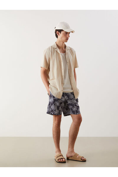 LC Waikiki شورت سباحة رجالي قصير منقوش من أوزماركا للموسم الجديد