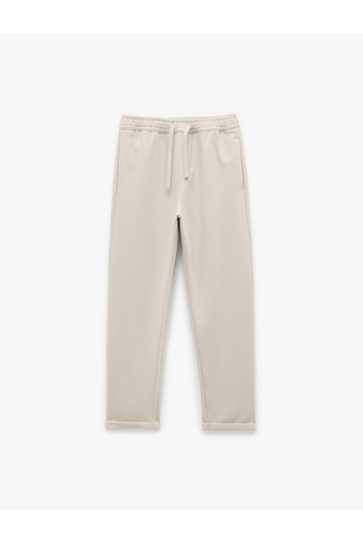 Koton Cep Detaylı Katlamalı Paça Rahat Kesim Beli Bağcıklı Pantolon