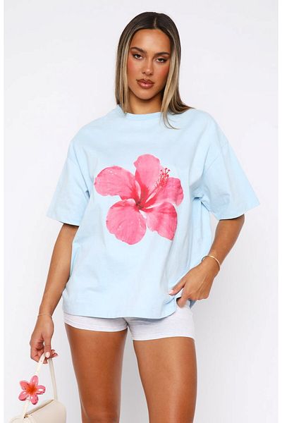 The Champ Clothing Tricou oversize albastru deschis pentru femei – model confortabil de vară cu imprimeu floral roz