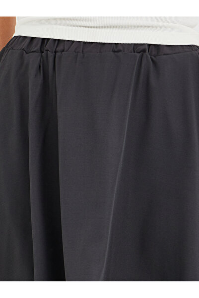 Styli Solid Asymmetric Hem Midi Skirt