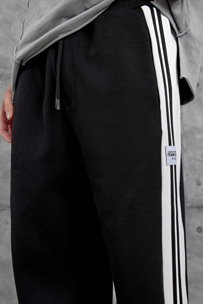 NOMARC Μαύρη αθλητική φόρμα με ετικέτα έκδοσης