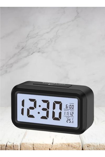 DLC Digital Alarm Clock Showing Date and Temperature