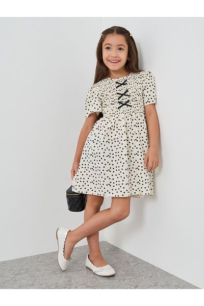 Styli Girls Off White All-Over Print Smocked A-Line Dress with Bow Detail