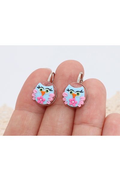 Atellier Wearable Art Playful Owls earrings on a silver stand