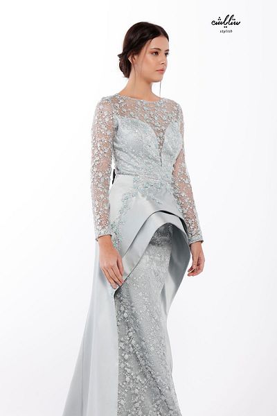 Stylish A high-cut dress with a mix of embroidered lace and an additional piece of embroidered fine satin in pistachio color.