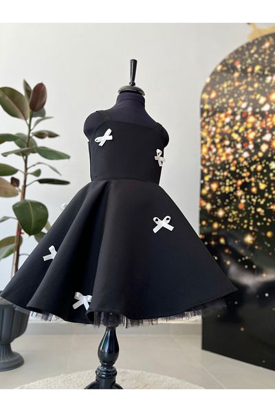 İkrabutikbursa Black Girl's Dress – White Bow Detail, Sleeveless, Flared Cut, Stylish and Elegant Design