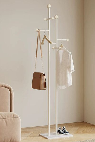 Generic a modern, minimalist floor-standing coat, Abaya and clothes rack, a Nordic and light luxury design
