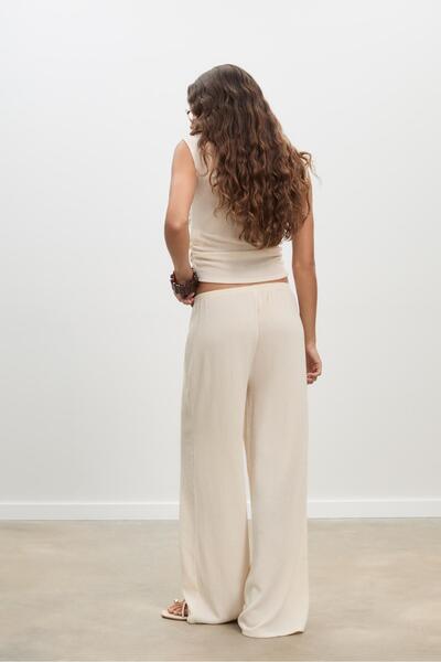 Stradivarius Flowing creased-effect trousers