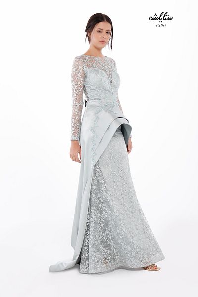 Stylish A high-cut dress with a mix of embroidered lace and an additional piece of embroidered fine satin in pistachio color.