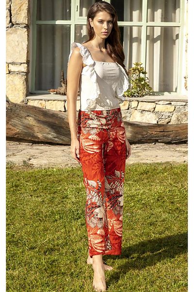 Stylish Elegant home outfit consisting of a white off-the-shoulder blouse with side pleats and red patterned pants