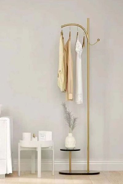 Generic a modern, minimalist floor-standing coat, Abaya and clothes rack, a Nordic and light luxury design