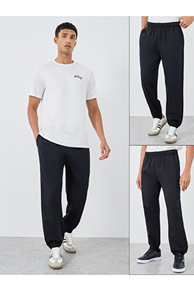 Styli عبوة من قطعتين - بنطال رياضي مريح من قماش تيري سادة مع أطراف مطاطية