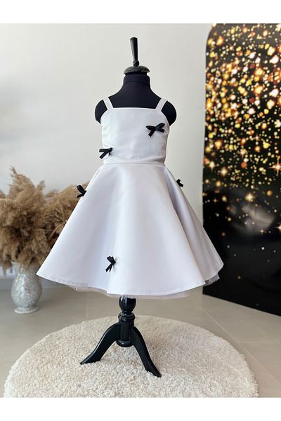İkrabutikbursa Gray Girl's Dress – Black Bow Detail, Flared Cut, Sleeveless, Stylish and Modern Design
