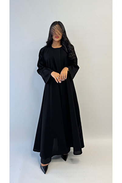 outline Black crepe abaya package with black floral embroidery, a cloche and a dress underneath the abaya