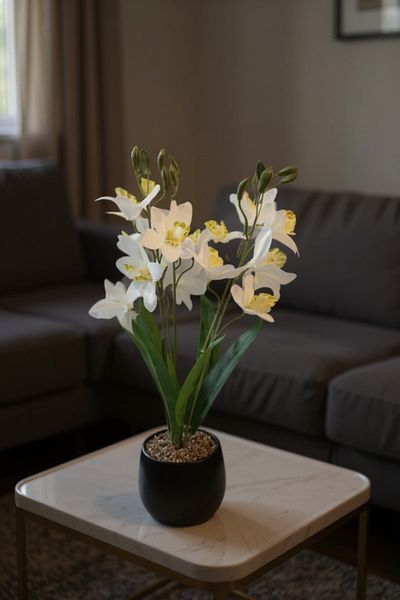 Living The distinctive artificial orchid plant, 55 cm, in a black pot.