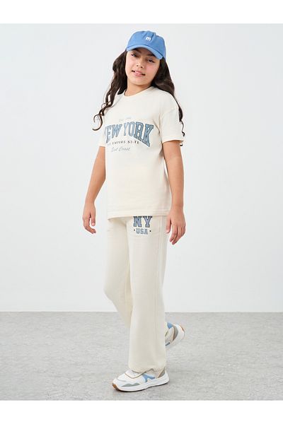 Styli Girls Off White Slogan Print Oversized T-Shirt and Wide Leg Joggers Set