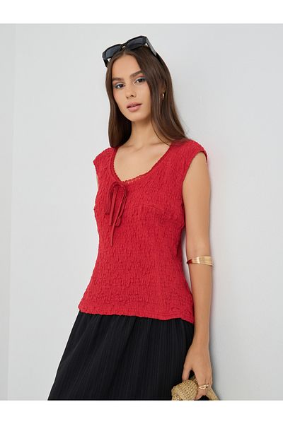 Styli Textured Sleeveless Tie-Up Detail Blouse