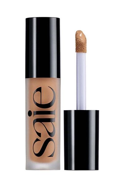 SAIE خافي العيوب Slip Tint Total Radiant مع النياسيناميد، 15 - متوسط إلى متوسط/أسمر مع لون زيتوني أساسي