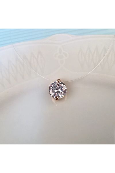 Eva Grace Mellany necklace, with transparent thread and round rose gold pendant