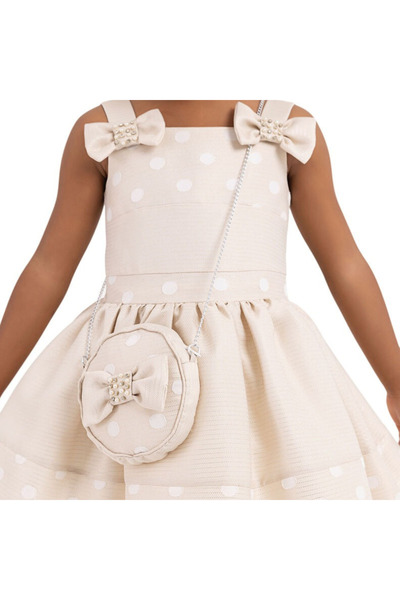 Pamina Elegant cream dress with polka dots and bow