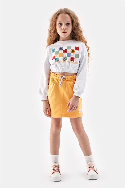 Tyess فتاة البلوز الأبيض