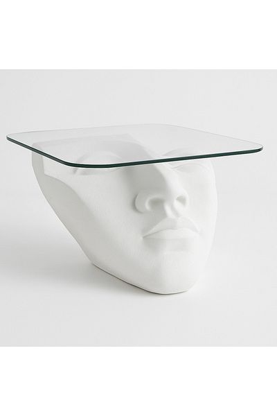 VİSAGE Sculptural coffee table with an abstract human face base and elegant top.