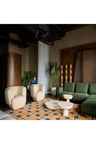 ket furniture Lacci A table with a smooth circular design and a treated rock texture