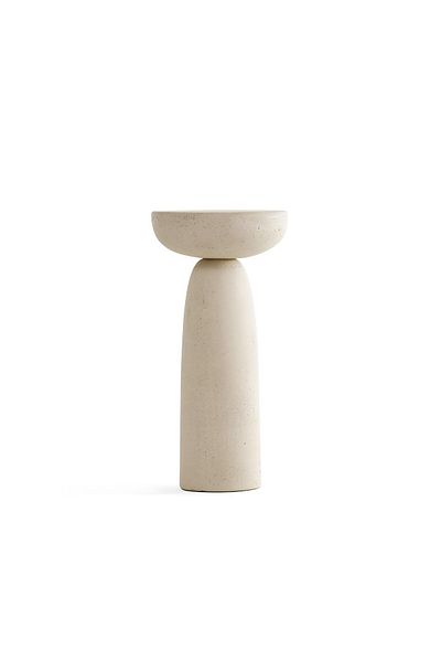 ket furniture Lacci A table with a smooth circular design and a treated rock texture