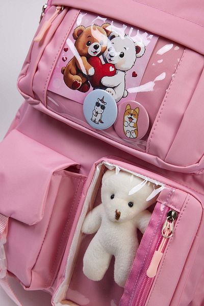 TRENDYOL SHOES Rosafarbener Kinderschulrucksack im koreanischen Stil mit Accessoires, Rosetten-Detail und Teddybär TAKAW26OI00004