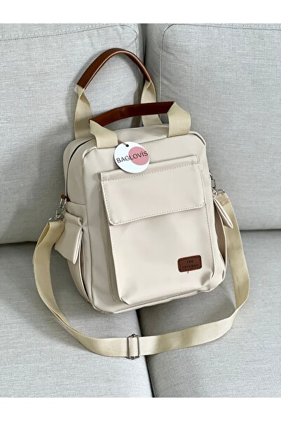 BAGLOVİS YANLARI VE ÖCÜ CEP DETAYLI KREM KADIN SIRT ÇANTASI
