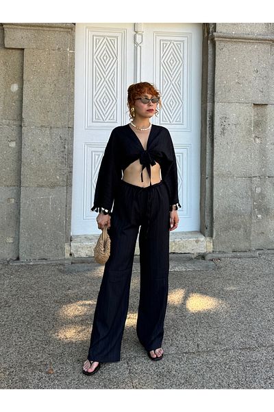 Bak'ap طقم مكون من قطعتين من قماش الكتان الفاخر المزين بشراشيب وربطة عنق من Palazzo Pants