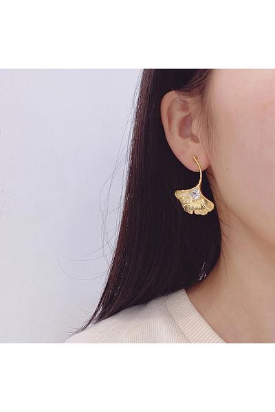 Eva Grace Janell earrings, gold, stainless steel, in the shape of a ginkgo leaf