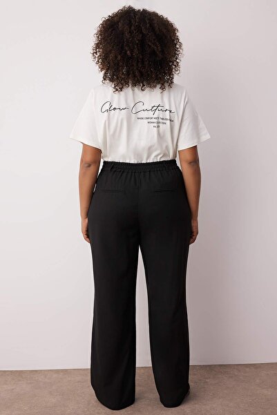 Trendyol Curve Schwarze, elastische, taillierte, gewebte Hose in Übergröße TBBAW26AR00000