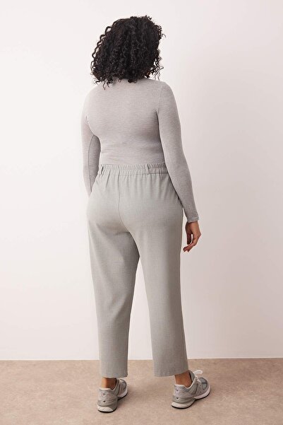 Trendyol Curve Šedé elastické tkané prémiové látkové kalhoty velké velikosti TBBAW26AR00012