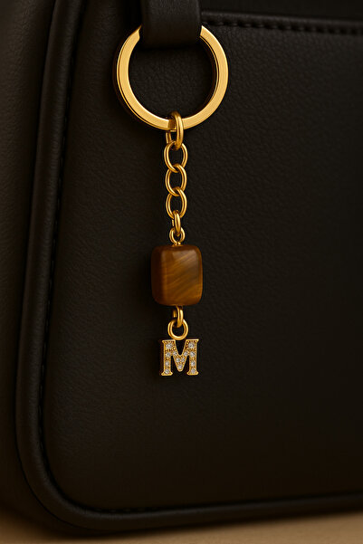 Han Ticarethane سلسلة مفاتيح عين النمر على شكل حرف M من الحجر الذهبي اللون