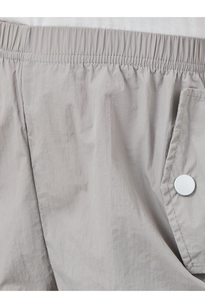 Styli Solid Elastic Waist Pocket Detail Pants