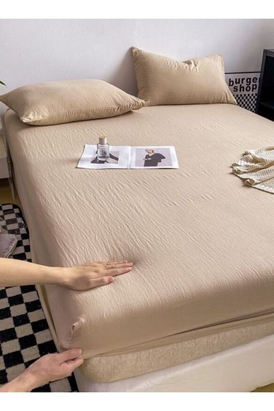 LUNA HOME 3-Piece Set: single-size fitted bedsheet and two pillowcases, washable cotton in a beige color.