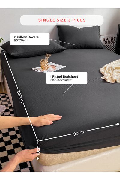 LUNA HOME 3-Piece Set: single-size fitted bedsheet and two pillowcases, washable cotton in a black color.