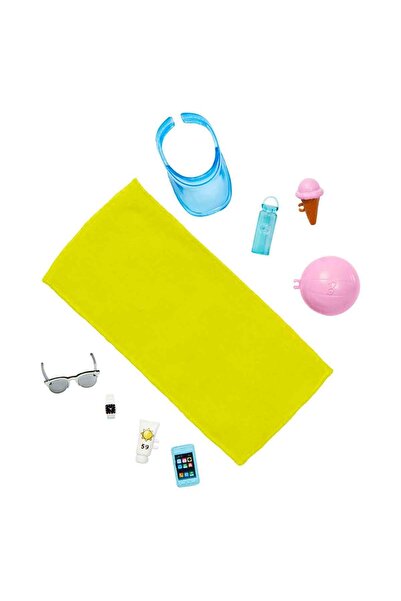 Barbie ® Bebek ve Aksesuarlar Deniz şortu ve plaj temalı aksesuarları olan sarışın Ken® bebek HPL74