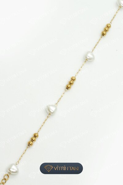 Çelik Kalp Detaylı Dorikalı Altın Renk Bileklik