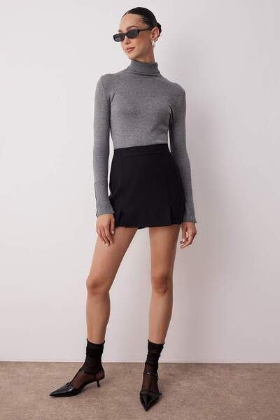 Trendyol Collection Чорна спідниця з подвійними розрізами довжиною супер-міні з тканого сорту TWOSS20SR0364