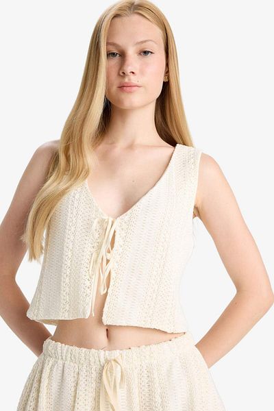 DeFacto Coool Loose Fit V-Neck Knitwear Look μπροστινή δεμένη αμάνικη μπλούζα F6260AX25SM