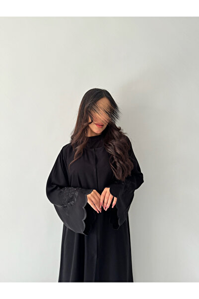 outline Black quarter-cloche abaya package with black rose embroidery and a dress underneath the abaya