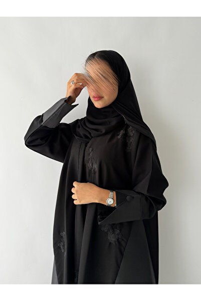 outline Black embroidered crepe abaya package and a dress underneath the abaya