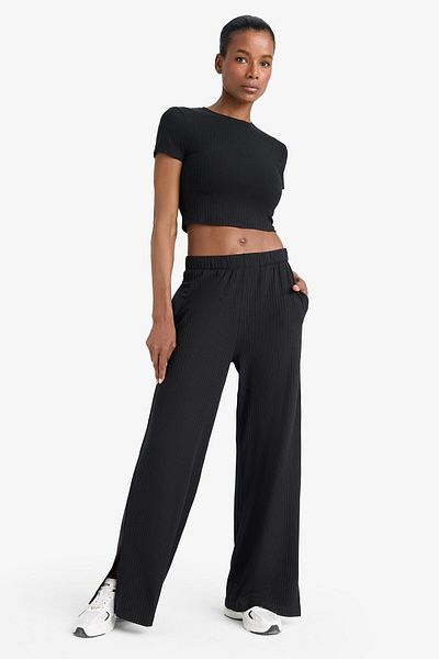 DeFacto DeFactoFit Pantaloni de sport lungi, subțiri, cu picioare largi, cu buzunare, cu tăieturi la picioare E2538AX25SM