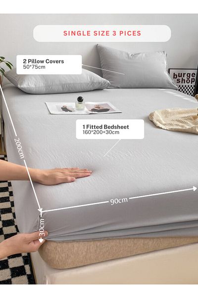 LUNA HOME 3-Piece Set: single-size fitted bedsheet and two pillowcases, washable cotton in a light grey color.