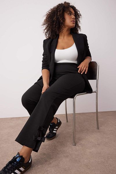 Trendyol Curve Black Flared Fit Knitted Large Size Pants with Bow Detail Tbbaw26Ar00003