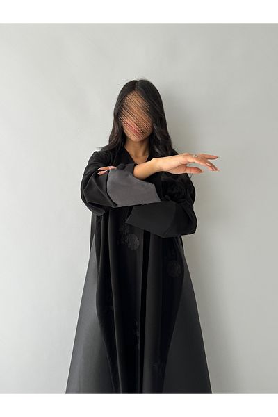 outline Black embroidered crepe abaya package and a dress underneath the abaya