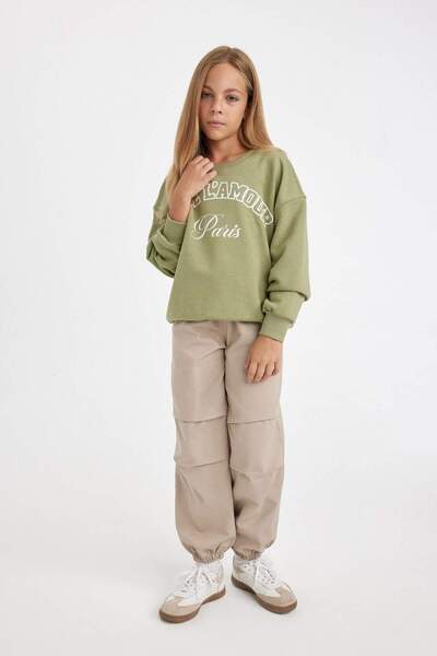 DeFacto Kız Çocuk Beli ve Paçası Lastikli Cepli Pamuklu Paraşüt Pantolon C8776A824AU